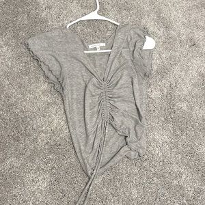 light grey cropped top with tie.